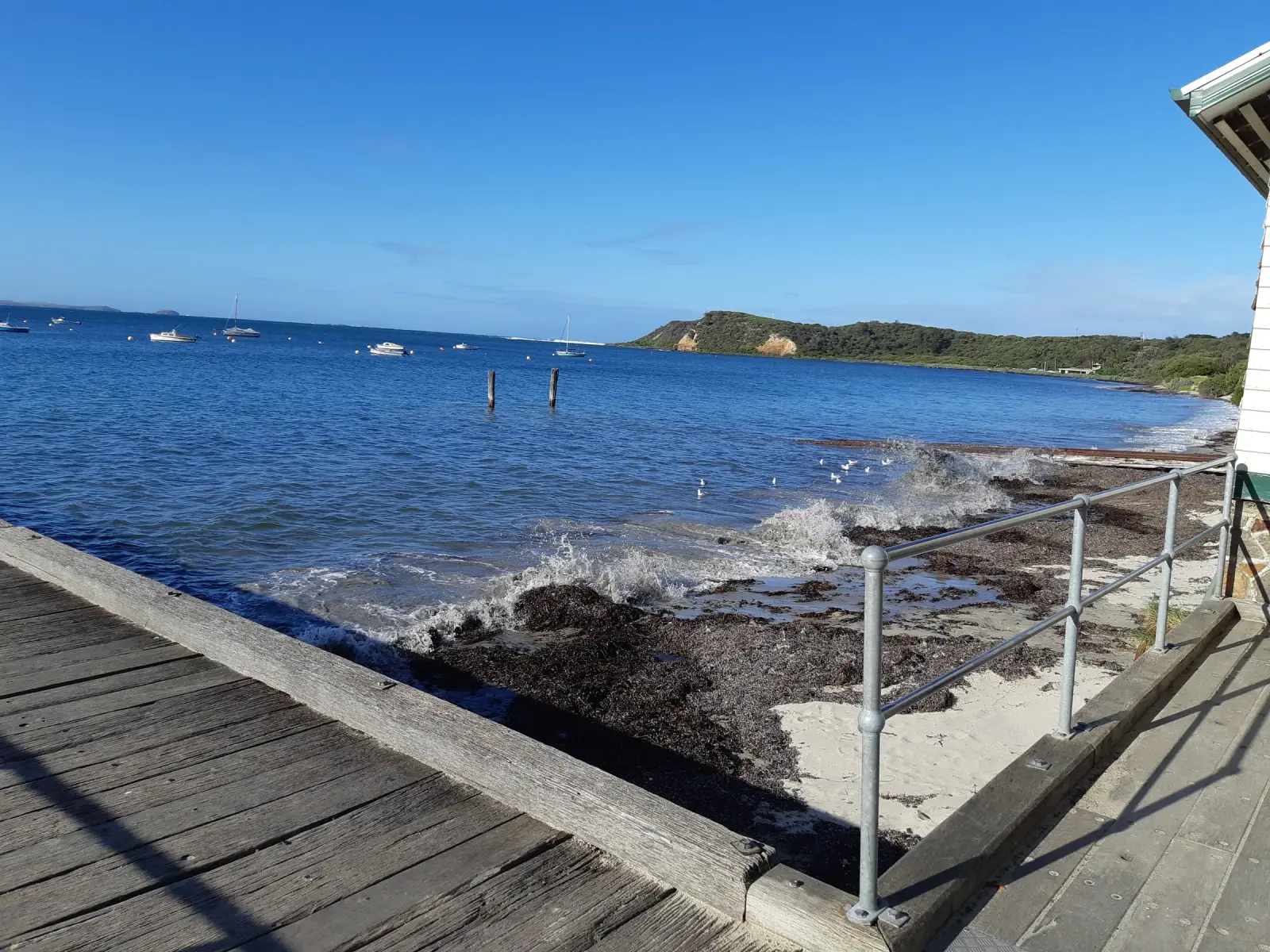 Flinders Pier extending into Western Port Bay on a quiet winter day