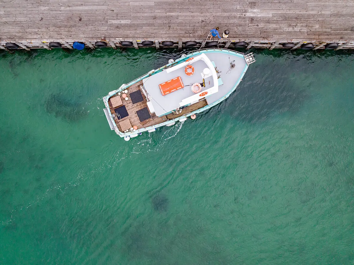 Polperro's coastal heritage - Sorrento Pier, tied to the Polperro winery's Peninsula identity